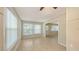 Bright living room featuring tile floors, large windows, and neutral paint, creating a warm and inviting atmosphere at 2462 Hyde Park St, Sarasota, FL 34239