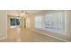 Spacious living room with tile floors and large windows, providing ample natural light and an airy feel at 2462 Hyde Park St, Sarasota, FL 34239