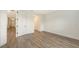 Bright bedroom with laminate floors, neutral paint color, and closet at 248 Altamura Cir, Nokomis, FL 34275
