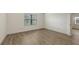 Bedroom featuring wood-style flooring and a bright window for light at 248 Altamura Cir, Nokomis, FL 34275