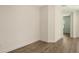 Empty room featuring wood flooring, modern paint job, and a neutral color scheme at 248 Altamura Cir, Nokomis, FL 34275