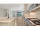 Modern kitchen featuring gas range, sleek microwave, and bright white countertop at 248 Altamura Cir, Nokomis, FL 34275