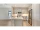 Well-lit kitchen with stainless steel appliances and island at 248 Altamura Cir, Nokomis, FL 34275
