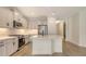 Modern kitchen boasts stainless steel appliances and ample cabinetry at 248 Altamura Cir, Nokomis, FL 34275