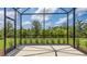 Enclosed patio provides a seamless transition to the green backyard, enhancing outdoor living at 248 Altamura Cir, Nokomis, FL 34275