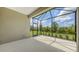 Enclosed patio offers bright, scenic views of the yard, perfect for relaxation at 248 Altamura Cir, Nokomis, FL 34275