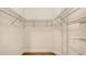 Spacious walk-in closet with adjustable metal shelving at 248 Altamura Cir, Nokomis, FL 34275