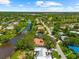 Beautiful aerial perspective featuring a home near a river and tree-lined street, surrounded by scenic neighborhood at 2504 Tanglewood Dr, Sarasota, FL 34239