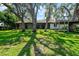 This spacious backyard has mature trees and a treehouse at 2504 Tanglewood Dr, Sarasota, FL 34239