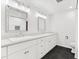 Elegant bathroom with double vanity, granite countertops, and modern fixtures at 2504 Tanglewood Dr, Sarasota, FL 34239