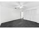 This bedroom offers tile floors, closet, and ceiling fan at 2504 Tanglewood Dr, Sarasota, FL 34239