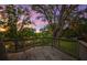 Wooden deck offering picturesque views of the serene waterfront and lush green backyard at 2504 Tanglewood Dr, Sarasota, FL 34239