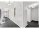 Bright hallway with modern lighting and unique wall decor at 2504 Tanglewood Dr, Sarasota, FL 34239