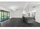 Modern kitchen featuring a large island with seating, pendant lighting, and stainless steel appliances at 2504 Tanglewood Dr, Sarasota, FL 34239