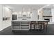 Kitchen featuring island with seating, stainless appliances, and modern finishes at 2504 Tanglewood Dr, Sarasota, FL 34239
