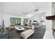Open living area features contemporary furnishings, fireplace, and seamless flow to the dining and kitchen at 2504 Tanglewood Dr, Sarasota, FL 34239