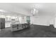 Open concept kitchen featuring an island with barstool seating and chandelier at 2504 Tanglewood Dr, Sarasota, FL 34239