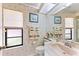 Cozy bathroom featuring floral wallpaper, a sink, and a large mirror at 2559 Wood Oak Dr, Sarasota, FL 34232
