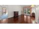 Spacious bedroom featuring gleaming hardwood floors, French doors, and ample natural light at 2559 Wood Oak Dr, Sarasota, FL 34232