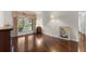 Bright bedroom featuring gleaming hardwood floors, French doors, and ample natural light at 2559 Wood Oak Dr, Sarasota, FL 34232