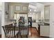 Bright kitchen with custom cabinets, granite countertops, and modern black appliances at 2559 Wood Oak Dr, Sarasota, FL 34232