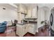 Bright kitchen with custom cabinets, granite countertops, and modern black appliances at 2559 Wood Oak Dr, Sarasota, FL 34232