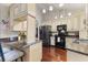 Bright kitchen with custom cabinets, granite countertops, and modern black appliances at 2559 Wood Oak Dr, Sarasota, FL 34232