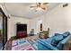 Cozy living room featuring hardwood floors, a ceiling fan, and sliding glass doors at 2559 Wood Oak Dr, Sarasota, FL 34232