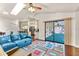 Cozy living room with hardwood floors, vaulted ceilings, and access to the kitchen at 2559 Wood Oak Dr, Sarasota, FL 34232