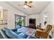 Bright living room boasting hardwood floors, comfortable seating, and access to the outdoor area at 2559 Wood Oak Dr, Sarasota, FL 34232