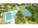 Aerial view of the community including the pool, tennis courts, and recreational areas at 2590 Floyd St, Sarasota, FL 34239