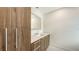 Bathroom features a light quartz countertop, dark wood cabinets, and modern lighting at 2590 Floyd St, Sarasota, FL 34239