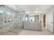 Elegant bathroom with marble accents, a glass-enclosed shower, and dual vanities at 2590 Floyd St, Sarasota, FL 34239