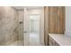 Luxurious bathroom showcasing a glass-enclosed shower and a stylish vanity with ample storage at 2590 Floyd St, Sarasota, FL 34239