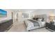 Stylish bedroom with a king-sized bed, contemporary furnishings, and an en-suite bathroom, offering comfort and convenience at 2590 Floyd St, Sarasota, FL 34239