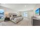 Bright bedroom features a comfortable king-size bed, neutral decor, and ample natural light at 2590 Floyd St, Sarasota, FL 34239