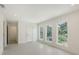 Bright bedroom featuring large windows and recessed lighting, offering a serene living space at 2590 Floyd St, Sarasota, FL 34239