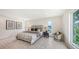 Bright bedroom featuring a comfortable king-size bed, neutral decor, and ample natural light at 2590 Floyd St, Sarasota, FL 34239