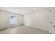 Spacious bedroom with a window offering natural light and tiled floors at 2590 Floyd St, Sarasota, FL 34239