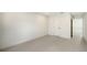 Spacious bedroom with neutral tile flooring and ample natural light, creating a calming environment at 2590 Floyd St, Sarasota, FL 34239