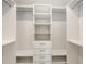 Walk-in closet with custom shelving and drawers, providing ample storage space at 2590 Floyd St, Sarasota, FL 34239
