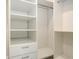 Spacious walk-in closet with custom shelving and drawers for optimal organization at 2590 Floyd St, Sarasota, FL 34239
