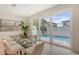 Modern dining area with views of the pool, perfect for indoor-outdoor entertaining at 2590 Floyd St, Sarasota, FL 34239