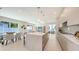 Open-concept kitchen and dining area with marble island, modern light fixtures, and seamless flow at 2590 Floyd St, Sarasota, FL 34239