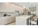 Modern kitchen with sleek countertops, integrated appliances, and designer lighting at 2590 Floyd St, Sarasota, FL 34239