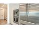 The modern kitchen features stainless steel appliances, including a double oven and refrigerator at 2590 Floyd St, Sarasota, FL 34239