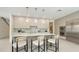 Contemporary kitchen with marble countertops, bar seating, and modern stainless steel appliances at 2590 Floyd St, Sarasota, FL 34239