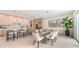 Sleek, modern kitchen with stainless steel appliances, marble countertops, and stylish bar seating at 2590 Floyd St, Sarasota, FL 34239