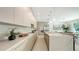 Modern kitchen featuring marble countertops and stainless steel appliances at 2590 Floyd St, Sarasota, FL 34239