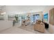 Open-concept living room features recessed lighting, dining area, and sliding glass doors to the pool at 2590 Floyd St, Sarasota, FL 34239